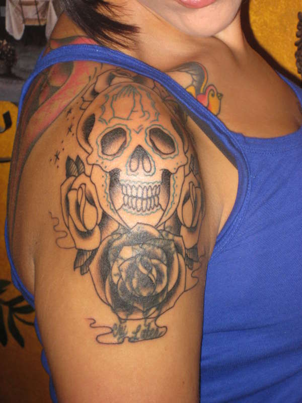 Skull cover up tattoo