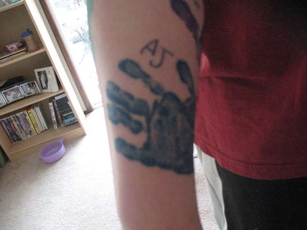 Son's handprint tattoo