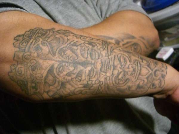 aztec statue tattoo