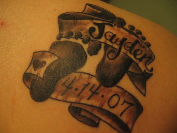 sons foot prints tattoo