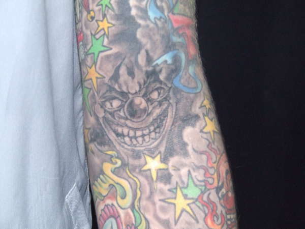 Peeping jester tattoo