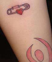 Safety Pins on both inner arms tattoo
