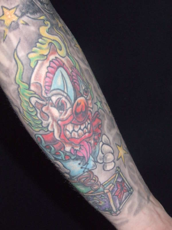 Scary clown in a box tattoo