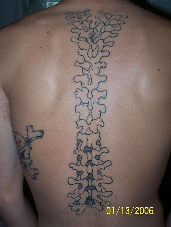unfinished spine tattoo