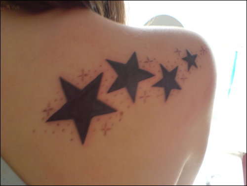 shoulder back star tattoo..x tattoo