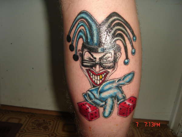 Joker rolling dice tattoo