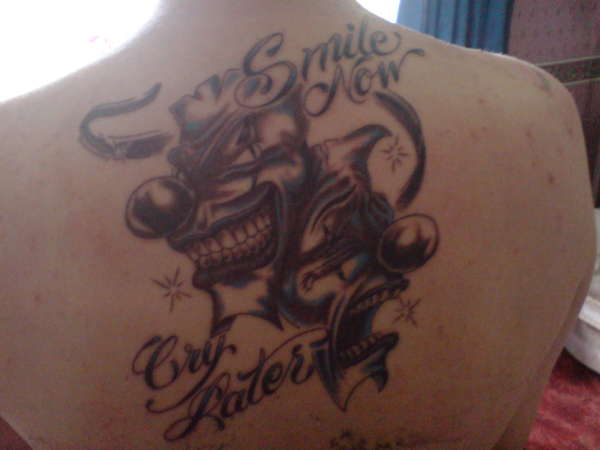 dramtic masks in klown form "smile now....... cry later" tattoo