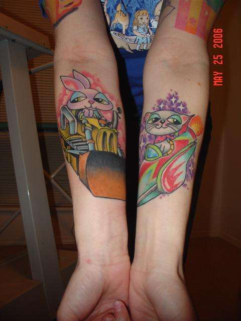 forearms. bulldozer & spaceship. tattoo