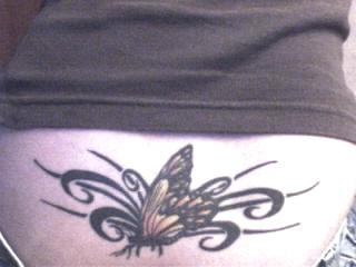butterfly on tribal tattoo