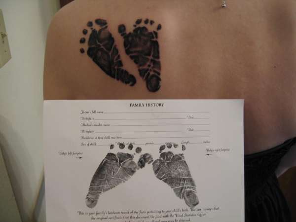 baby's foot prints tattoo
