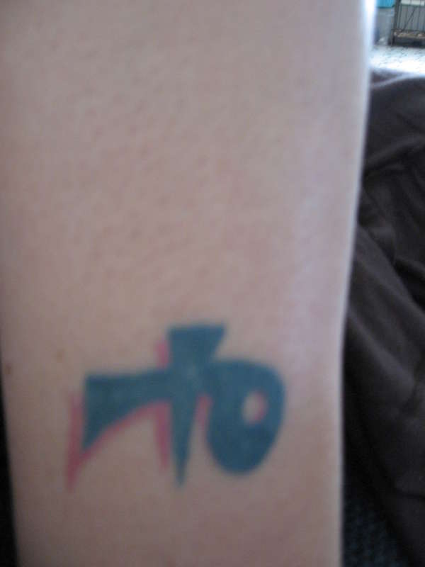 'Strength' ankle tat tattoo