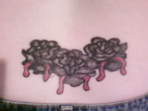 Three bleading roses tattoo