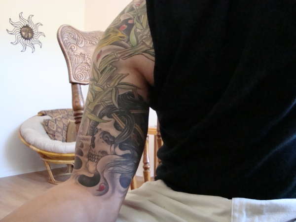 geisha skull inside arm tattoo