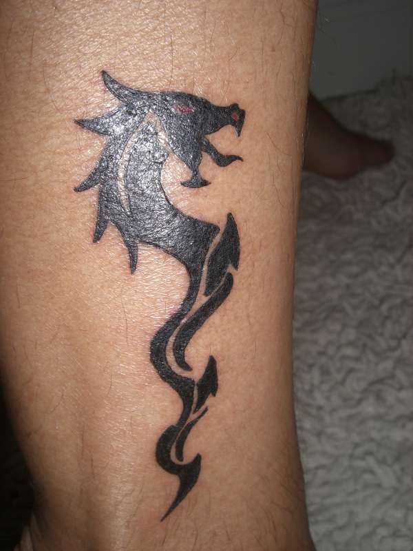 Dragon leg tattoo