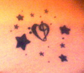 Music heart and stars tattoo