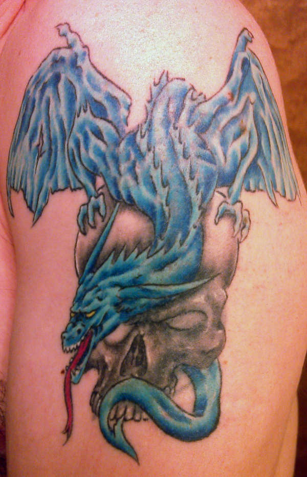 Blue dragon with skull tattoo