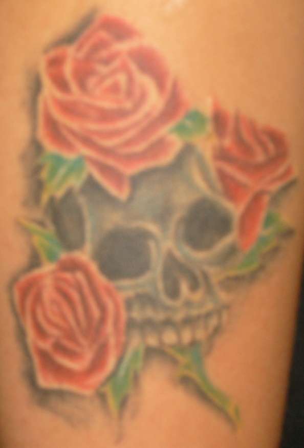 Right arm skull tattoo