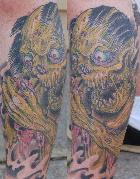 Zombie eating heart tattoo