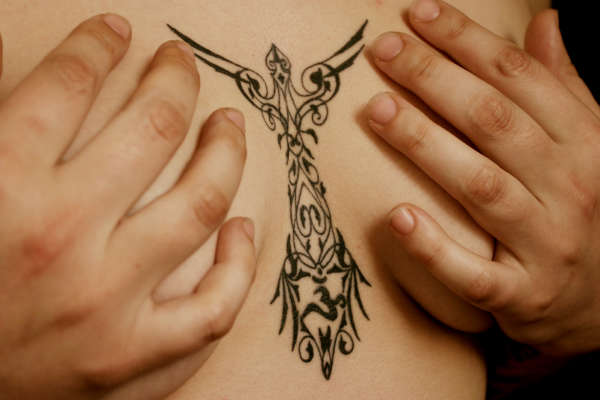 filigree chest tattoo
