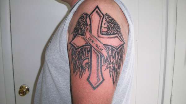 cross on arm tattoo