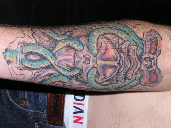 biomech forearm tattoo