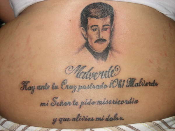 Malverde and prayer tattoo