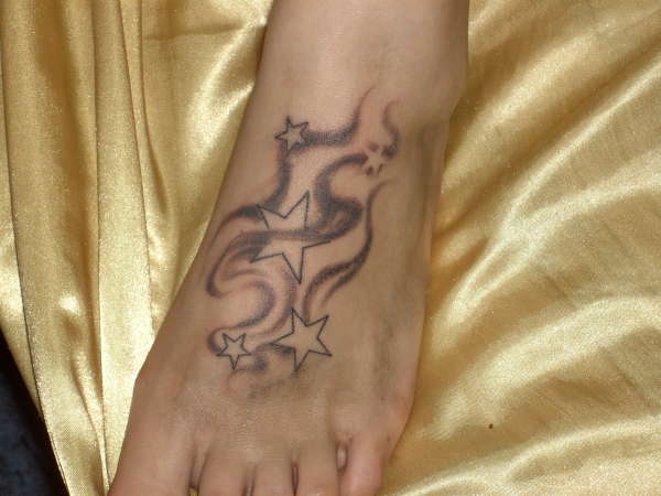 my gf's tattoo on her foot tattoo