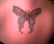 My Pretty Butterfly in the middle of my shoulder blades tattoo