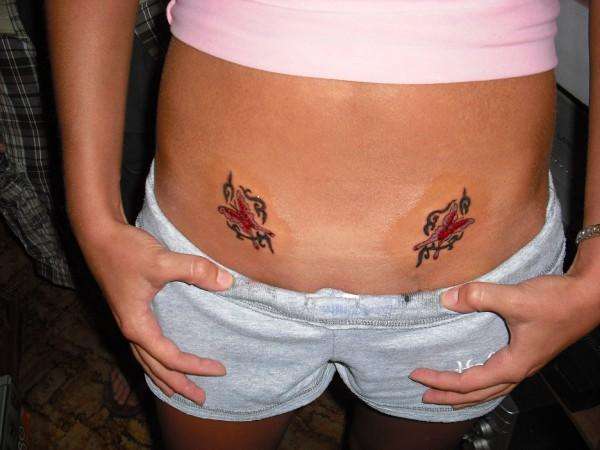 lower stomach butterflys tattoo