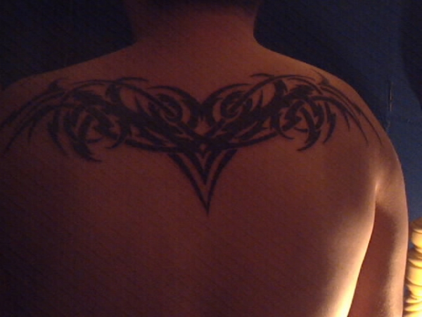 tribal with lighting bolts tattoo