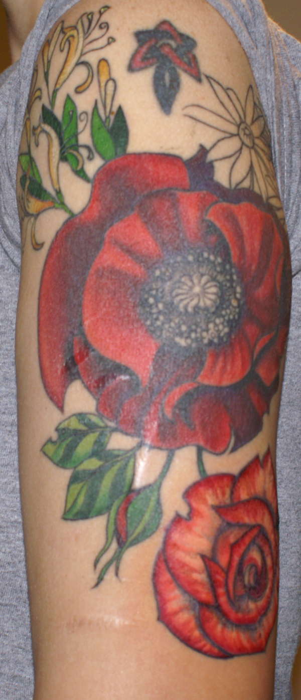 Beginning of floral half-sleeve tattoo