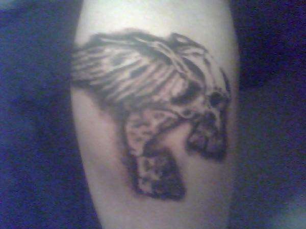 right calf skull n wings tattoo
