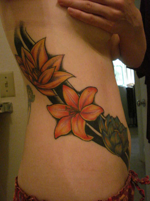 Flower side piece tattoo