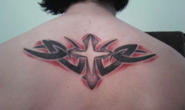 Cross with  a tribal design tattoo