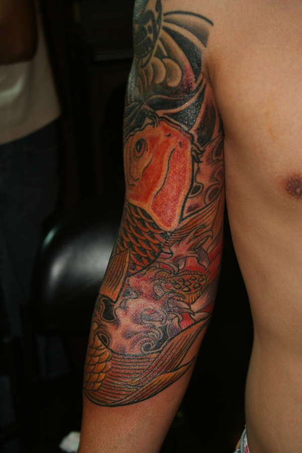 yellow koi fish with red peony and blue lotus tattoo