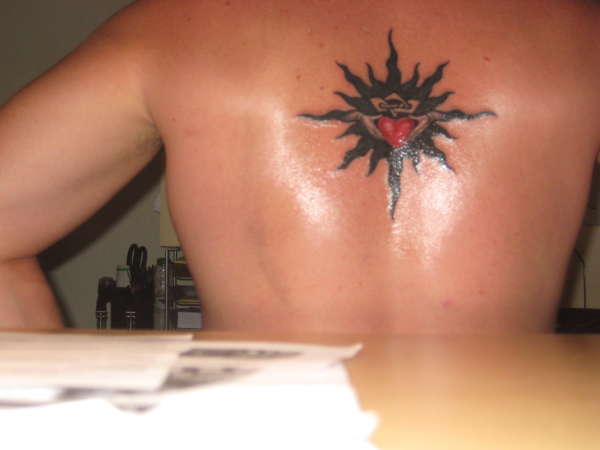 tribal sun/claddagh tattoo