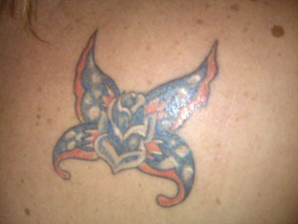 Butterfly with a rose body tattoo