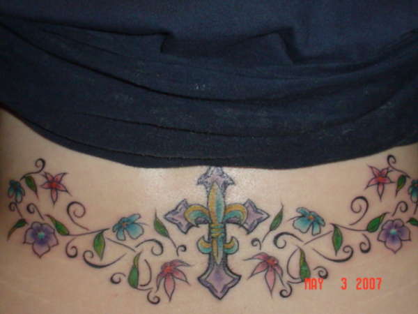 fleur de lis cross on lower back tattoo