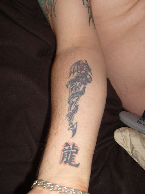 dragon with dagger tattoo