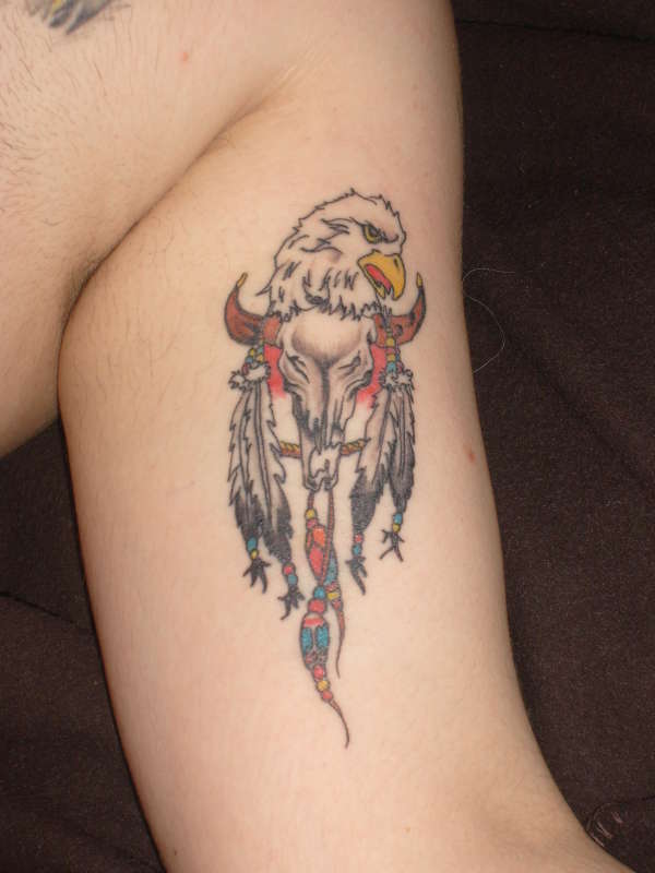 eagle head on animal skull tattoo