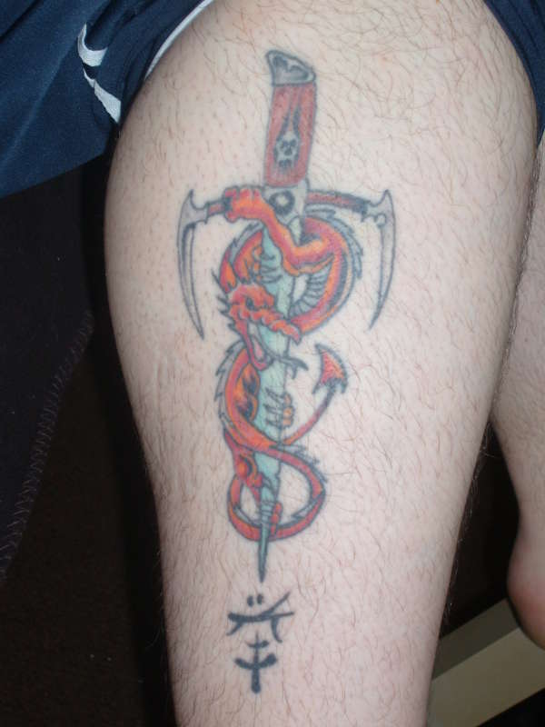 red dragon with dagger tattoo