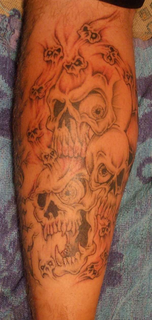 Back of Leg Skulls finished tattoo