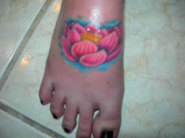 lotus flower on foot tattoo