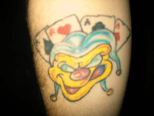 Joker on inside arm tattoo