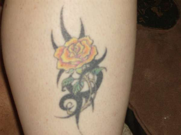 Wife's rose with tribal. tattoo