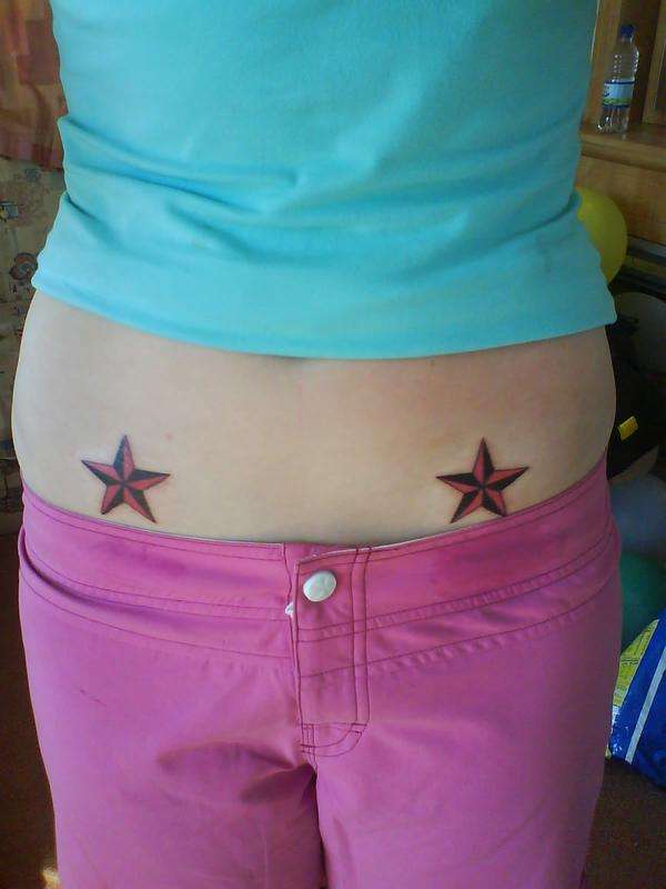 Pink and black nautical stars tattoo