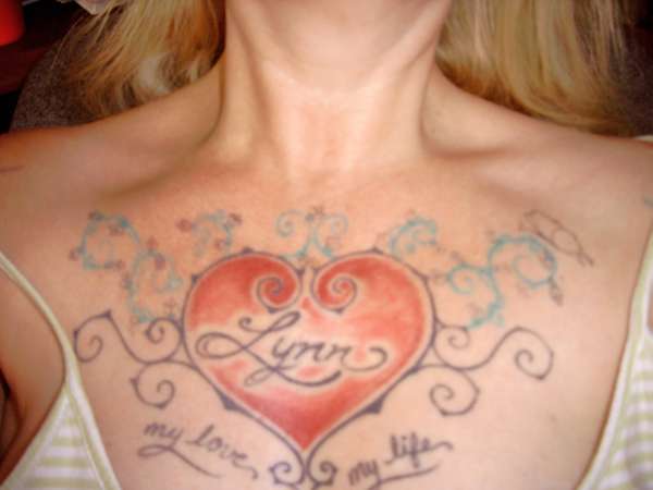 Trible Heart with my husbands name tattoo