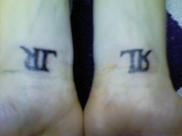 ? hmm..right..o...left...? tattoo