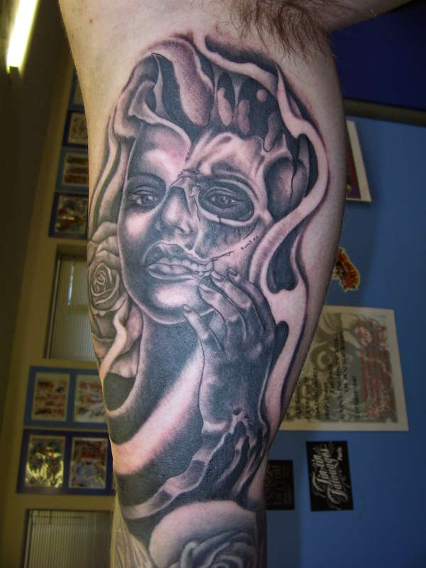 Half zombie lady face tattoo