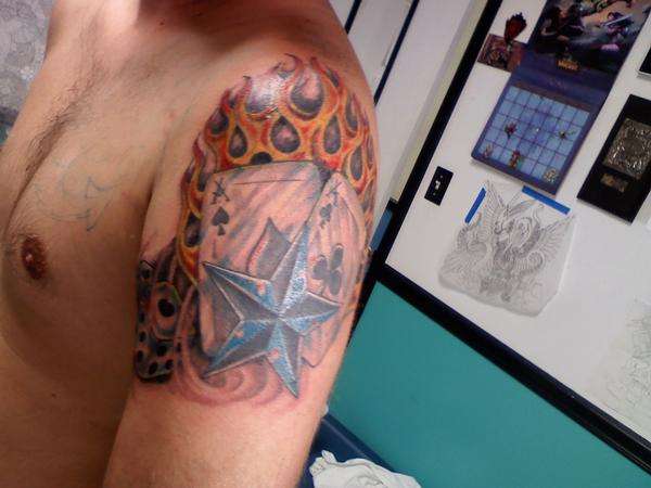 shoulder piece tattoo